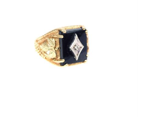 A Gentleman's, 1940's, 10 ct gold, onyx and diamond ring, centrally claw-set with a rectangular panel of black onyx inset wit