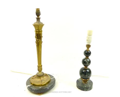 Two marble, ornamental lamps, one composed of three spherical, polished marble balls on  circular, marble plinth base (Height