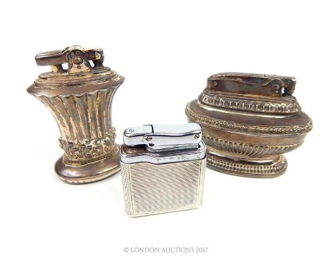 A hallmarked silver Colibri lighter together with two Ronson table lighters.