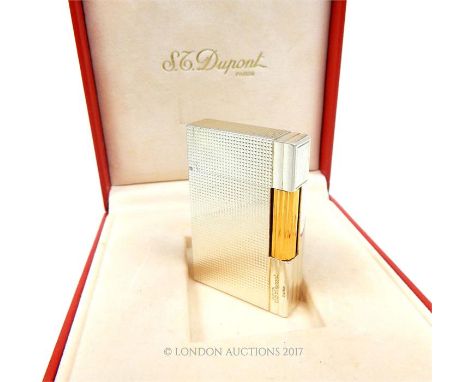 A boxed silver plated Dupont lighter.