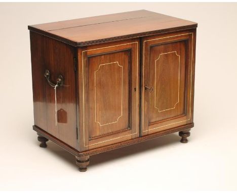 A ROSEWOOD SPECIMEN TABLE CABINET, 19th century, of rounded oblong form with bone stringing, reeded edged top and base, two p