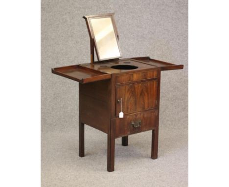 A GEORGIAN MAHOGANY WASHSTAND, late 18th century, the moulded edged split hinged top opening to interior with wash bowl apert