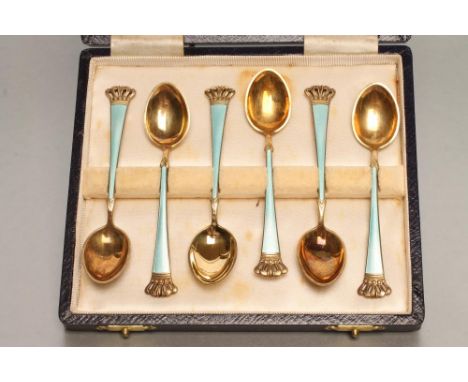 A SET OF SIX DANISH ART DECO SILVER GILT AND ENAMEL COFFEE SPOONS, stamped Sterling, with crown pierced finials and turquoise