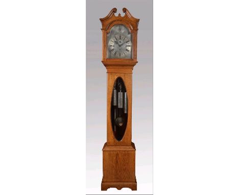 AN OAK CHIMING LONGCASE, c.1900, the three train movement with anchor escapement striking on Westminster chimes on five chrom