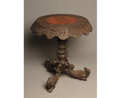 A BURMESE CARVED HARDWOOD OCCASIONAL TABLE, 19th century, the circular top with carved banding of birds amongst foliage and p