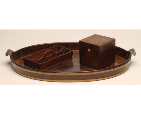 A GEORGIAN MAHOGANY AND BRASS BOUND TEA TRAY, 18th century, of oval form, with scrolled handles, 22  3/4" x 14 1/4", together