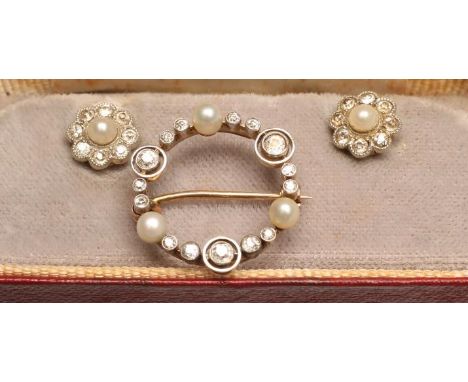 A PAIR OF PEARL AND DIAMOND EAR STUDS, the cultured pearls within a border of eight brilliant cut diamonds to 9ct gold posts,