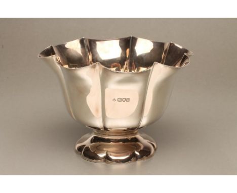 AN EDWARDIAN SILVER ROSE BOWL, maker Henry Wilkinson &amp; Sons Ltd., London 1910, of lobed circular form on swept foot, 7 3/
