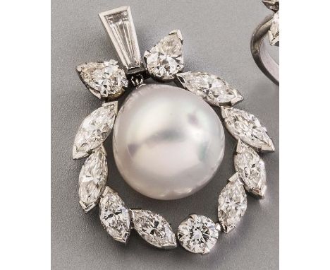 A CULTURED PEARL AND DIAMOND PENDANT, the large pear shaped pearl drilled and pendant from a baguette cut diamond bale within