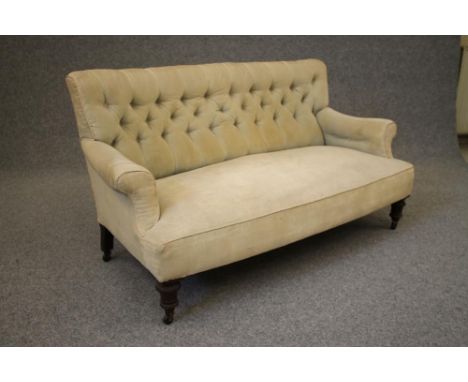 A VICTORIAN MAHOGANY FRAMED SOFA button upholstered in lime green dralon, mildly curved back with straight top rail, scrolled