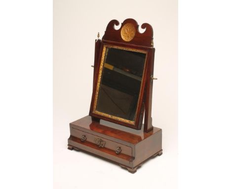 A GEORGIAN MAHOGANY AND PARCEL GILT SMALL TOILET MIRROR, mid 18th century, the oblong plate with foliate surround and scrolle