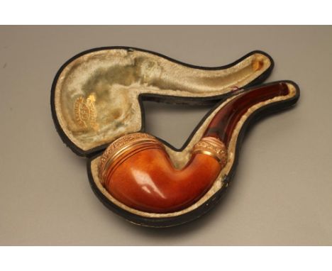 A MEERSCHAUM CALABASH PIPE, the plain bowl with foliate chased gold plated mount and ferrule, and with amber mouthpiece, 6" l