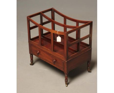 A REGENCY MAHOGANY CANTERBURY of oblong dished form with three slatted divisions, frieze drawer with turned wood handles, on 