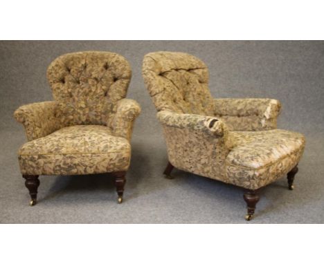 A PAIR OF VICTORIAN WALNUT FRAMED ARMCHAIRS of handsome proportions, button upholstered in a flower and foliate weave, arched