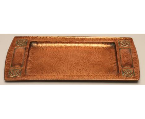 AN ARTS AND CRAFTS COPPER TRAY of oblong form with dished central section, the raised outer rim with indented handles and fou