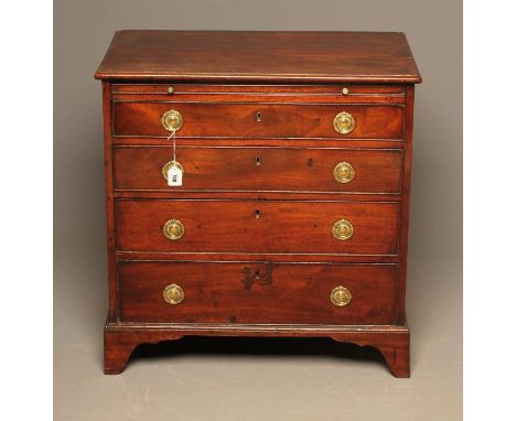 A GEORGIAN MAHOGANY SMALL CHEST, late 18th century, the moulded edged top over slide and four graduated long drawers with bra