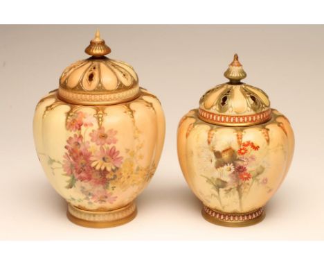 TWO GRADUATED ROYAL WORCESTER CHINA POT POURRIS AND COVERS, 1899 and 1912 (smaller), of lobed ovoid form painted in polychrom