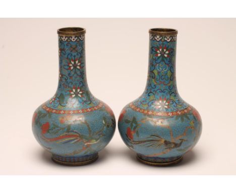 A PAIR OF CHINESE CLOISONNE ENAMEL VASES of baluster form, inlaid with cranes flying amongst peonies below a scrolling foliat