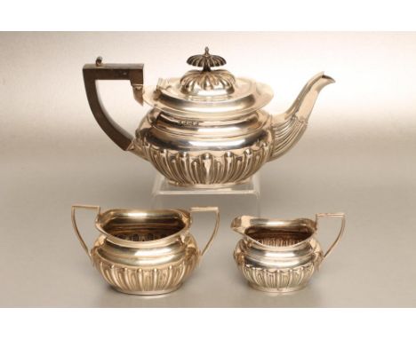 AN EDWARDIAN BACHELOR'S SILVER THREE PIECE TEA SERVICE, maker's mark WA, Birmingham 1902 and 1903, (sugar basin) of semi flut
