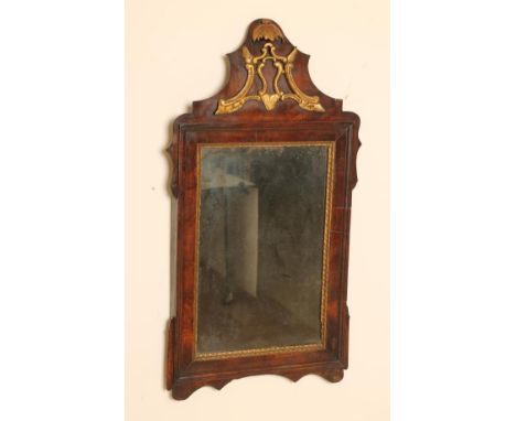 A GEORGIAN MAHOGANY FRAMED FRET PIER GLASS, mid 18th century, the oblong plate within a gilt foliate and moulded surround, ar