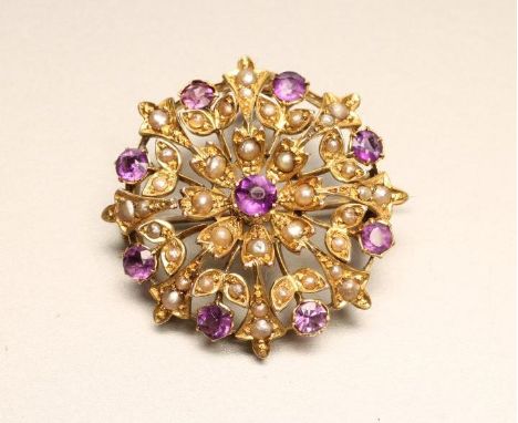 A VICTORIAN AMETHYST AND SEED PEARL CLUSTER BROOCH/PENDANT, claw set with nine facet cut amethysts and numerous seed pearls (