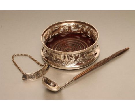 AN EDWARDIAN IRISH SILVER BOTTLE COASTER, maker Neill (Belfast), Dublin 1910, of waisted cylindrical form, pierced, chased an