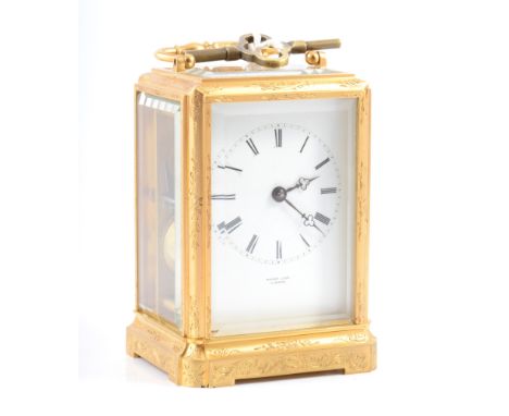 French engraved gilt metal carriage clock, white enamel dial signed Henry Capt a Geneve, platform escapement movement by Japy