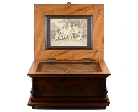 Imperial Symphonion, late 19th century, twin comb, playing 135/8" discs, in a walnut and floral marquetry inlaid case, 56cm.