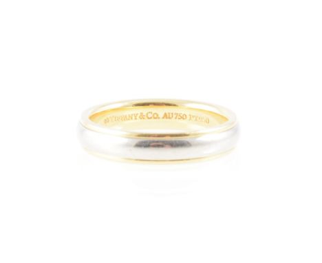 Tiffany - an 18 carat yellow gold and platinum band 3.8mm wide D shape, the centre platinum with a border of yellow gold, mar