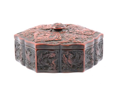 Chinese cinnabar lacquer hexagonal shape box and cover, probably Qing, serpentine outlines, modelled with a dragon, pheonix a