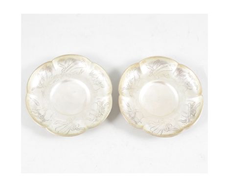 Pair of Chinese silver tea saucers, Wang Chung of Hong Kong, 1880-1900, each of lobed design, engraved decoration of grouped 