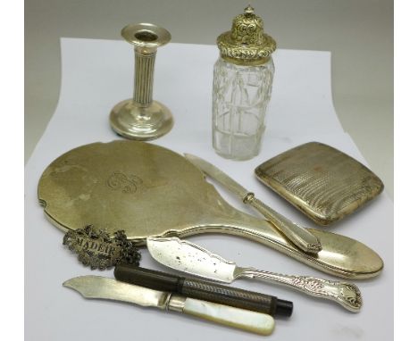A Victorian silver Madeira label, a silver butter knife, an 800 silver cigarette case , a silver candlestick, a silver pen, a