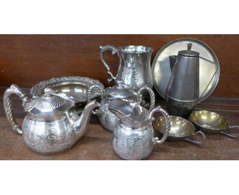 A plated mug, a three piece tea service, one other tea set and a coaster