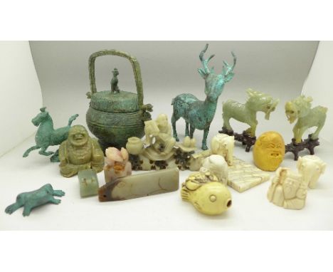 A collection of carved items including ivory elephants, a/f, jade and soapstone, a metal deer, a sensor, etc.