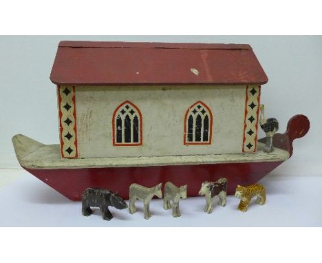 A wooden model of Noah's Ark with a small quantity of animals, 65cm