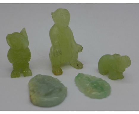 A carved jade monkey and four other carved items
