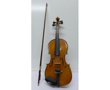 A violin with two piece back, length of back including button 34.5cm, with bow, cased