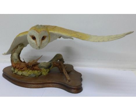 A large model of a barn owl, Natural World Collection by Caithness, 52cm