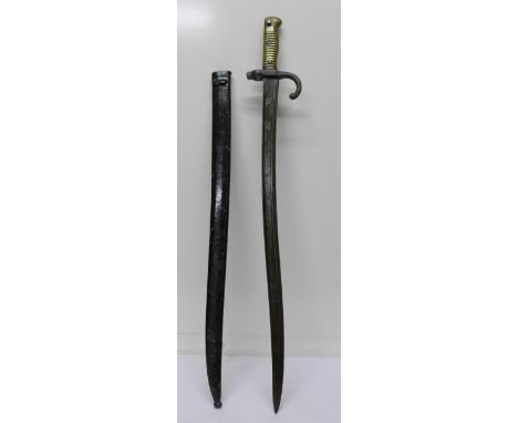 A French bayonet and scabbard, length of blade 57cm, stamped 90622