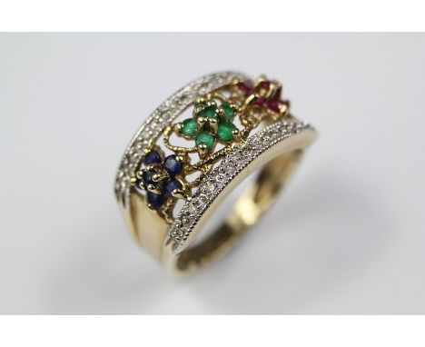 A Lady's 9ct Yellow Gold Sapphire, Ruby and Emerald Dress Ring. The ring set with approx 18 pts of old-cut dias, size N, appr