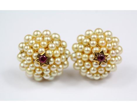 A Pair of Indian 14/15ct Gold, Pearl and Ruby Beehive Earrings. The earrings measure approx 12 x 10 mm, with screw backs, app