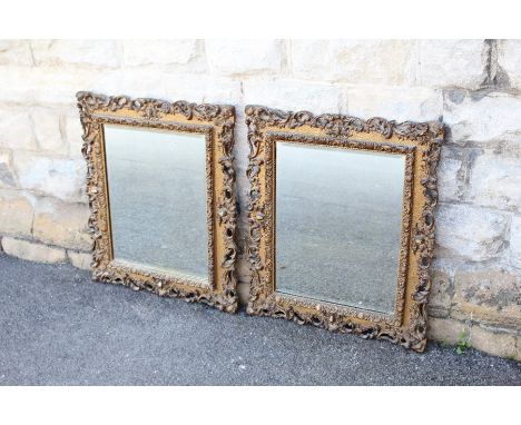 A Pair of Vintage Mirrors, the mirrors having wood carved foliate frames with bevelled glass, the glass only measures approx 