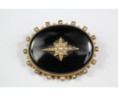 A Victorian 14/15ct Yellow Gold and Black Enamel Mourning Brooch, approx 40 x 30mm, the brooch set with a seed-pearl star mot