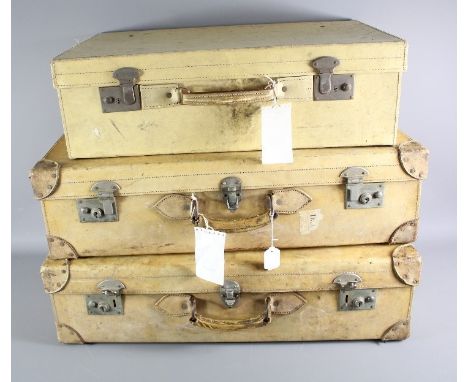 Three Vintage Velum and Leather Travelling Suitcases.