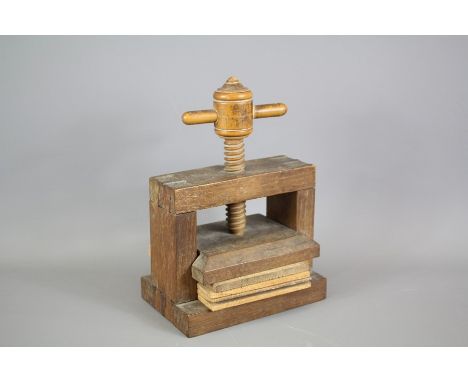 A Vintage Flower Press; the wooden press has three press blocks, wooden screw, approx&nbsp; 15 x 13 x 10 cms.