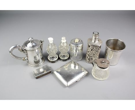 A Silver Cigarette Case, Birmingham hallmark, dated 1904, mm BTC together with a silver lighter, engine turned with the monog