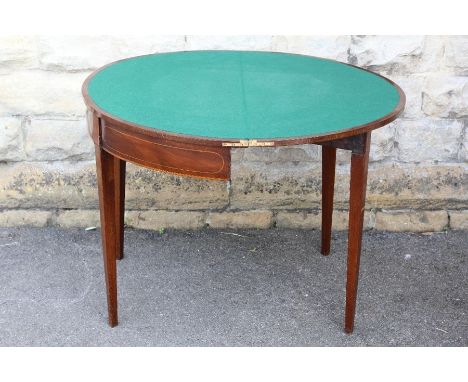 Antique Victorian Mahogany Demi-Lune Card Table. The fold-over table with decorative inlay and green baize interior on tapere