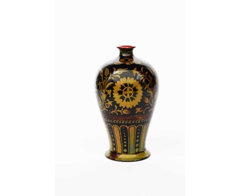 A Bernard Moore Pottery vase, baluster form, painted with flowers and foliage in gold on a deep red flambe ground, printed Be