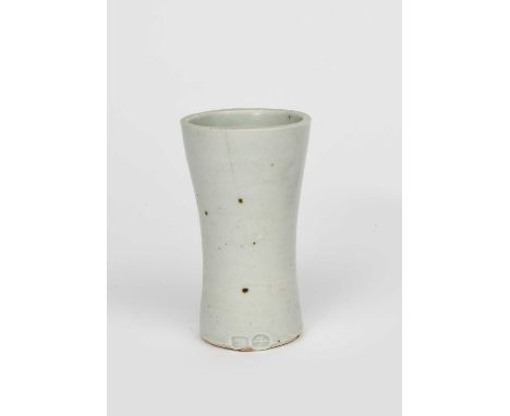 Φ Bernard Leach CBE (1887-1979)a Leach Pottery stoneware vase, waisted cylindrical form, covered to the foot with a pale cela