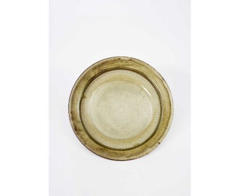 Richard Batterham (1936-2021)a large stoneware dish with chatter band, covered in an ash glazeunsigned, incised 141cm. diam. 